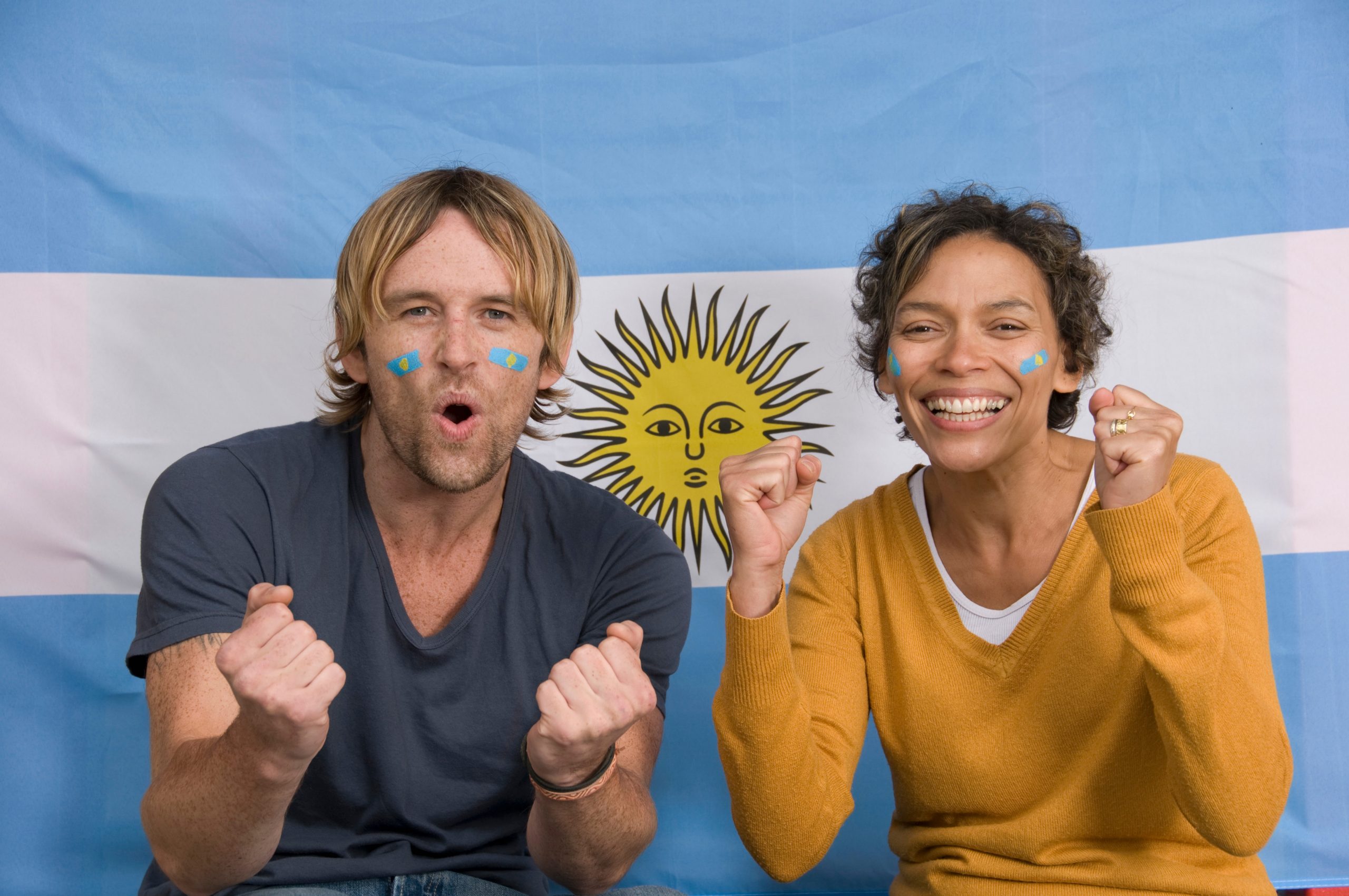 Couple smiling with Argentinian flag