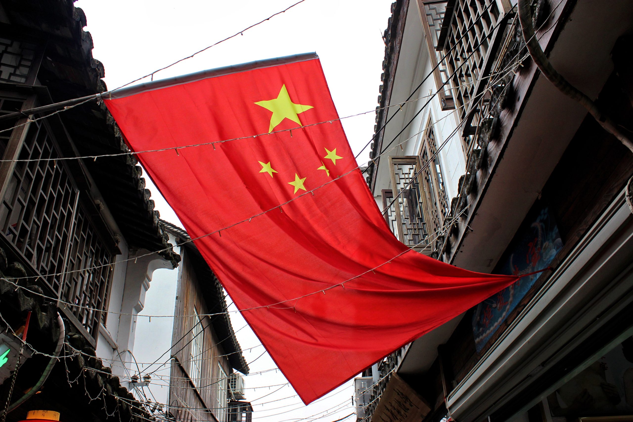 the-flag-of-china-hanging-in-an-ancient-alleyway-2024-05-27-00-42-43-utc